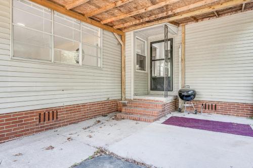 a brick house with a window on the side of it at 1 Mi to Robins AFB Family-Friendly Home! in Warner Robins