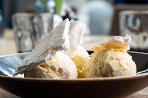 a bowl of ice cream on a table at voco Brussels City North by IHG in Vilvoorde