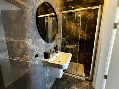 a bathroom with a sink and a mirror at Seaview Three-O-Two in St. Paul's Bay
