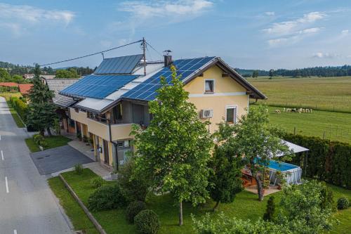 an aerial view of a house with solar panels on it at House Dijana With Pool - Happy Rentals in Nova Vas