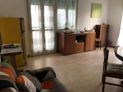 a living room with a couch and a table at Da Scilla in Punta Marina