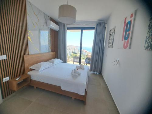 Ένα ή περισσότερα κρεβάτια σε δωμάτιο στο prestige hill apartments