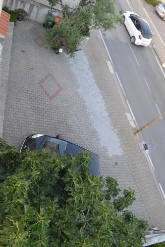 a car is parked in a parking lot at Apartments Jolić in Vodice