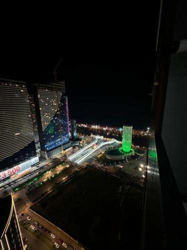 a view of a city at night with buildings at Moonlight Apart-Hotel Batumi in Batumi