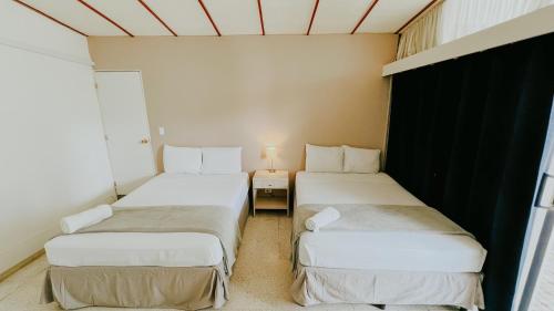 Postel nebo postele na pokoji v ubytování LA RUTA HOTEL CORPORATIVO