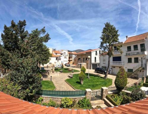 a view of the courtyard of a apartment building at Pure Mountain - Serra da Estrela in Erada