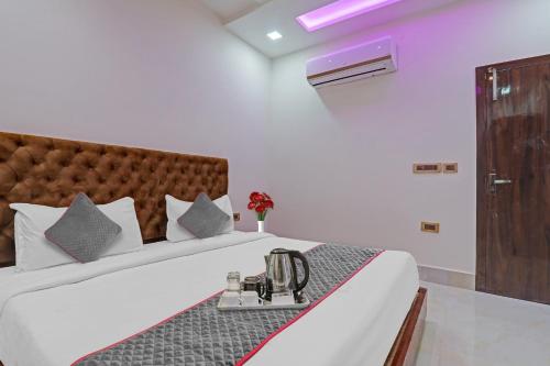 a hotel room with a bed with a machine on it at Townhouse Hotel Spotlight in Nawābganj