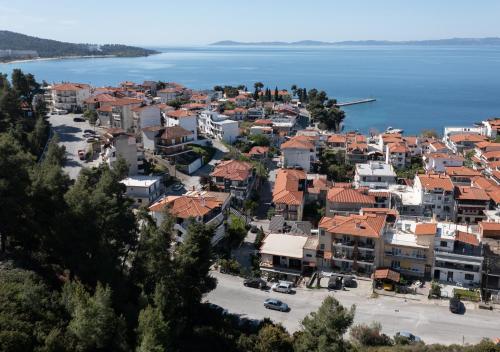 an aerial view of a town next to the water at ELZO Home in Neos Marmaras
