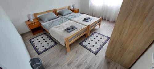 a bedroom with a bed with two pillows on it at Momin konak Brnjica in Brnjica