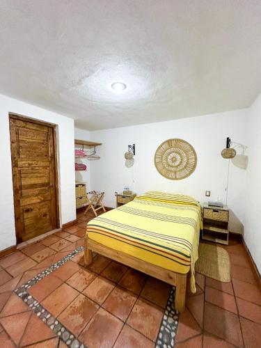 a bedroom with a bed in a room at Posada El Palomar in Pátzcuaro