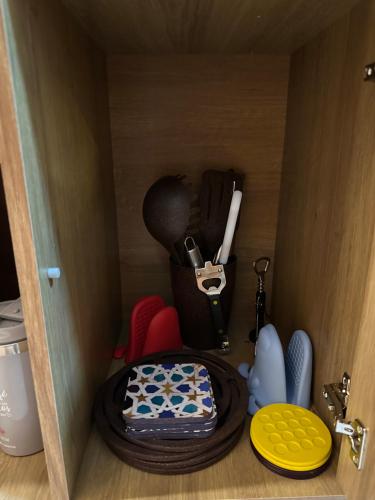 a wooden cabinet with a cake and dishes in it at Viva a bela Copacabana! in Rio de Janeiro