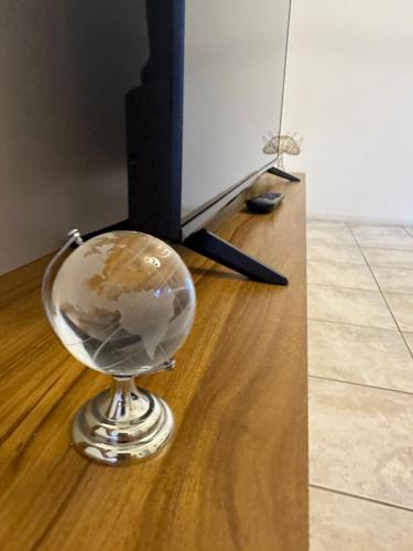 a glass globe sitting on top of a wooden floor at Viva a bela Copacabana! in Rio de Janeiro