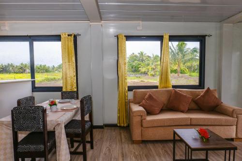a living room with a couch and a table at Shalini Garden Hotel & Apartments in Singatoka