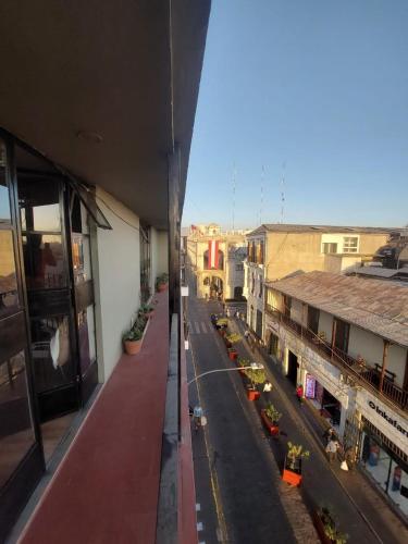 a view of a city street from a building at maizon plaza I in Arequipa