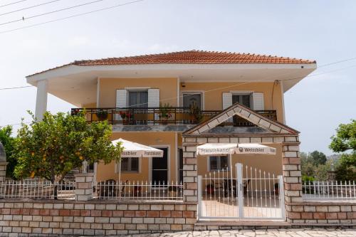 a house with a gate in front of it at Apartments Vasileiou Suite 4 in Preveza