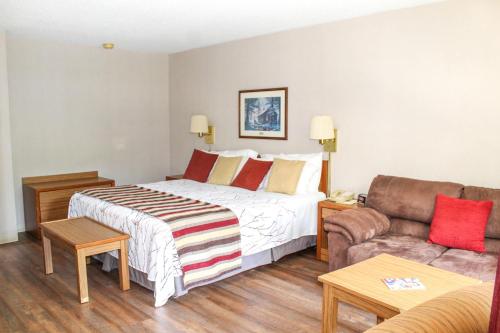 Katil atau katil-katil dalam bilik di Highland Manor Inn