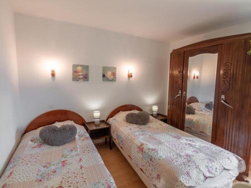 Ένα ή περισσότερα κρεβάτια σε δωμάτιο στο L Aiguillou