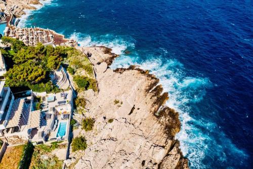 an aerial view of a cliff with the ocean at Blue Views Villa with Heated Pool & Jacuzzi in Dubrovnik