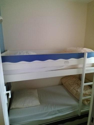 Ένα ή περισσότερα κρεβάτια σε δωμάτιο στο Appartement Les Sables Blancs