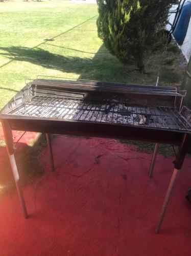 a picnic table with a grill on top of it at Casa de campo tepeyac in El Salto
