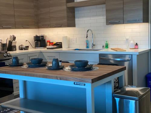 a kitchen with blue bowls and plates on a counter at Dapper down in West Sacramento