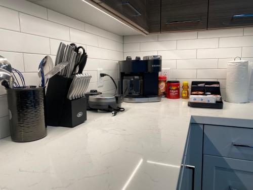 a kitchen with a counter with a coffee maker at Dapper down in West Sacramento