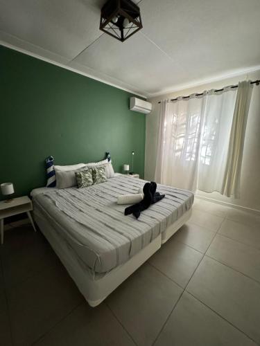 Ένα ή περισσότερα κρεβάτια σε δωμάτιο στο Villa Grand Jardin