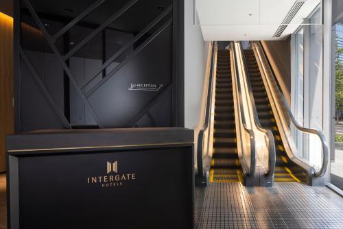 a set of escalators in a building at Hotel Intergate Osaka Umeda in Osaka
