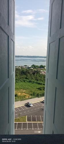a view from a window of a parking lot at Lylinz sierra heights in Pasir Gudang