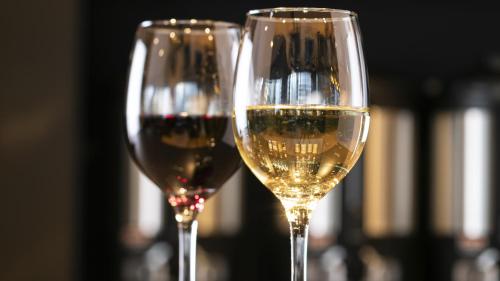 two glasses of white wine sitting next to each other at Hotel Intergate Osaka Umeda in Osaka