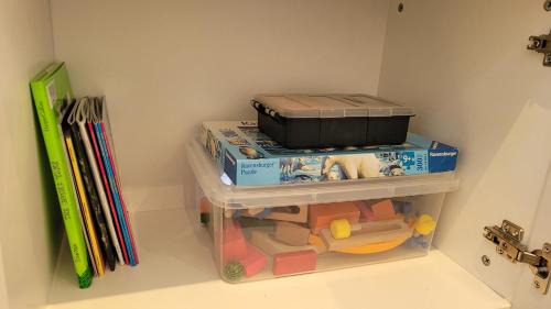 a childs playroom with a toy shelf and books at Bliss Stay Cosy Home 3Bedroom 2Bath in Croydon