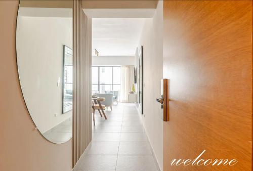 a hallway with a mirror and a door at Bella Vista cozy-deluxe near Downtown center in Santo Domingo