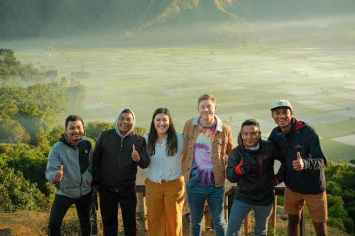 a group of people standing on top of a mountain at Rautani Sembalun in Sembalun Lawang