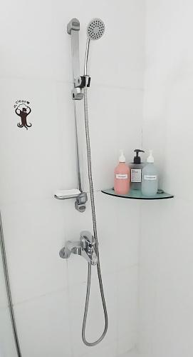 a shower in a bathroom with a shower head at Hongik Univ Hongdae Stay in Seoul