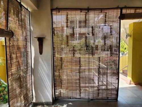 a door with a gate in a room at Saur Homestay in Jaipur