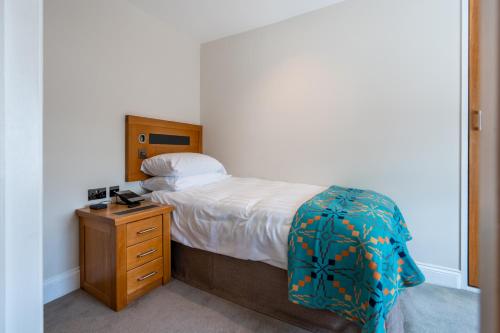 Letto o letti in una camera di Gwesty Cymru