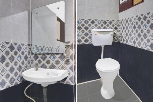 a bathroom with a toilet and a sink at Hotel O HRR Hotels Near Paradise circle in Hyderabad
