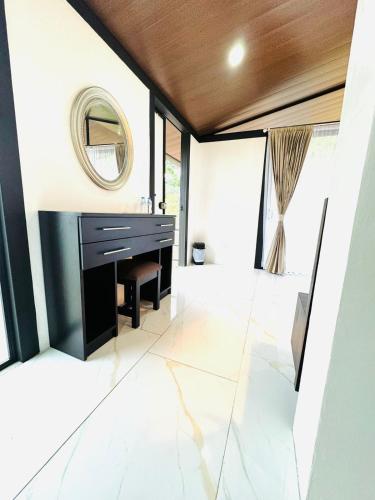 a bathroom with a sink and a mirror at Cabañas La Hermosa #1 in Guápiles