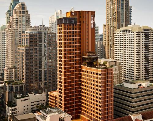 a view of a large city with tall buildings at Sindhorn Midtown Hotel Bangkok, Vignette Collection by IHG in Bangkok