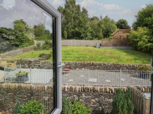 a view from a window of a yard at Bishop Fell in Newby Bridge