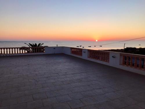 a view of the sunset from the roof of a building at Villa Carpe Diem in Sangho