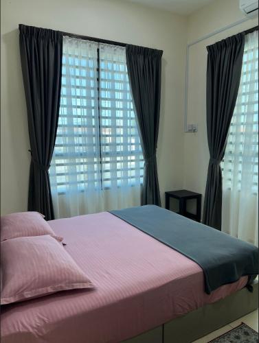 Кровать или кровати в номере Roseeyou Homestay