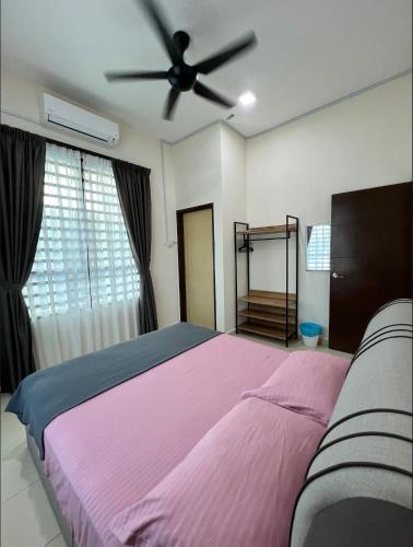 Кровать или кровати в номере Roseeyou Homestay