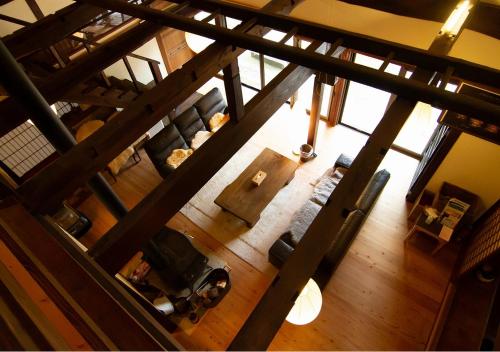 an overhead view of a living room with a table at 古民家やまおか in Iwasaki