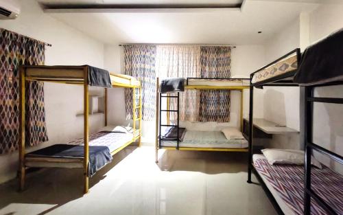 a room with two bunk beds and a window at Shepherd Stories - Community stay for Social Entrepreneurs in Hyderabad