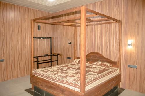 Katil atau katil-katil dalam bilik di Gangana Resort Inn