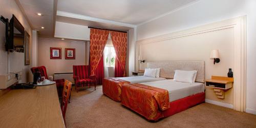 Postel nebo postele na pokoji v ubytování Apollo Hotel