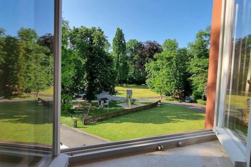 a view of a park from a window at Schloss Kirchschönbach bei Prichsenstadt in Prichsenstadt
