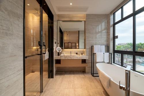 Katil atau katil-katil dalam bilik di Xiamen Lujiang Mingjia Hotel