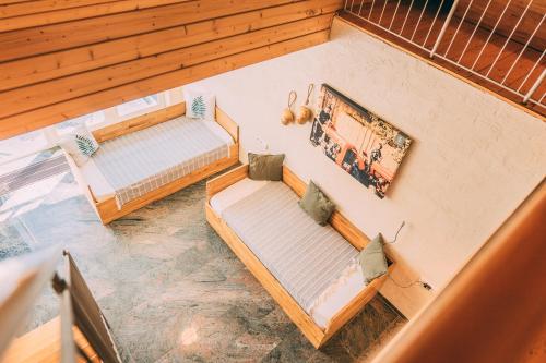 an overhead view of two beds in a room at Gut Hügle Erlebnishof in Ravensburg